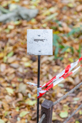Iron street sign without signs and symbols during the day