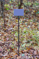 Iron street sign without signs and symbols during the day