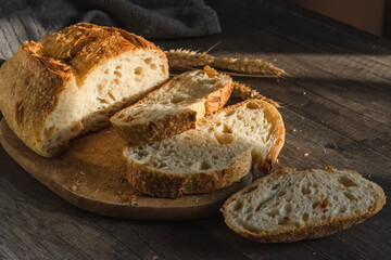 Various rustic bread on a wooden board. Healthy food and farming concept