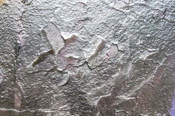 Background for design. Empty silver background. A part of wall of silver color with peeling of texture. No people.
