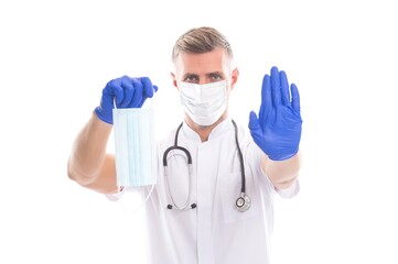 physician medical worker man with phonendoscope suggest stop the virus by using respirator mask and rubber gloves during coronavirus pandemic, covid19