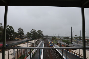Its an overcast morning, top view of a train slowly approaching in Wyong Station, Australia.