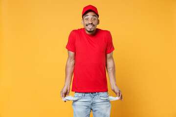 Delivery employee african man 20s in red cap blank print t-shirt uniform workwear work courier dealer service during quarantine coronavirus covid-19 virus concept isolated on yellow background studio.