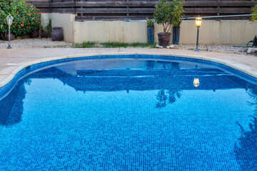 Fototapeta na wymiar Blue water swimming pool close up view