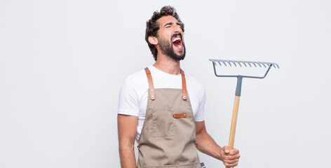 young man screaming furiously, shouting aggressively, looking stressed and angry