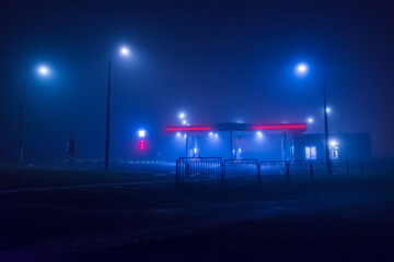 night fog evening gas station lights no people