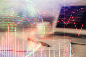 Double exposure of financial graph drawings and desk with open notebook background. Concept of forex market