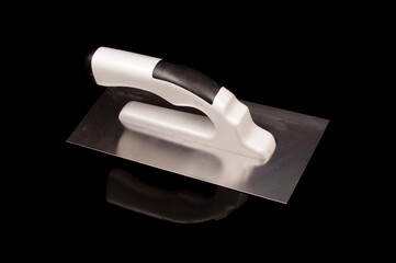 Plastering trowel isolated on the black