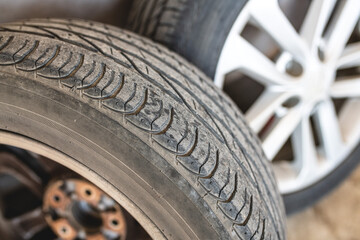 Old car tires at the tire repair shop. Selective focus