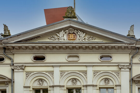 Ornate pediment above the entrance of an historic building in Klaipeda, Lithuania