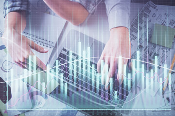 Double exposure of man and woman working together and forex graph hologram drawing. Financial analysis concept. Computer background. Top View.