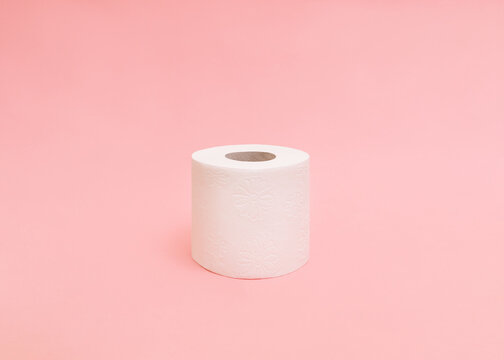 Pastel pink toilet paper rolls on black wooden background Stock Photo by  FabrikaPhoto