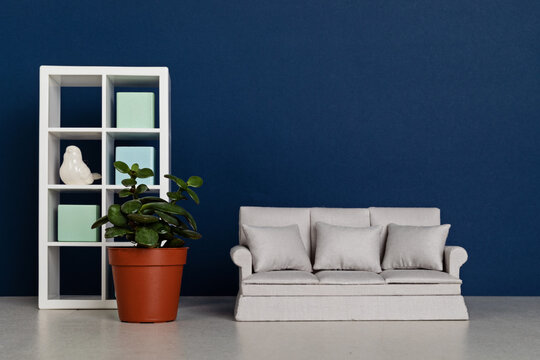 Stylish minimal living room interior of modern apartment with trendy elegant furniture, sofa and bookcase. Interior design mockup