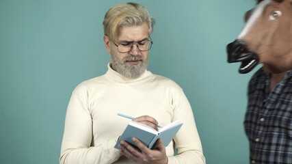 Funny Writer Thinker Concept. Funny and Crazy Idea. The Curious Man with Horse Head Mask. Humorous video. Concept Non-standard Situation. - Powered by Adobe