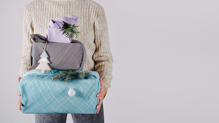 Holiday gifts christmas background with many Furoshiki gift boxes wrapping in zero waste style....