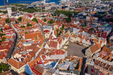 Amazing aerial drone shot of old town of Tallinn, Estonia at sunset