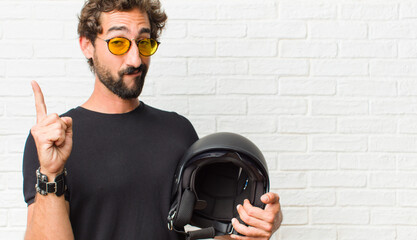 young man feeling like a genius holding finger proudly up in the air after realizing a great idea,...