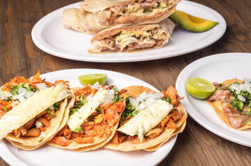 Mexican food background. Party mexican food. Mexican food concept on wooden table. Traditional Mexican food. Tacos.