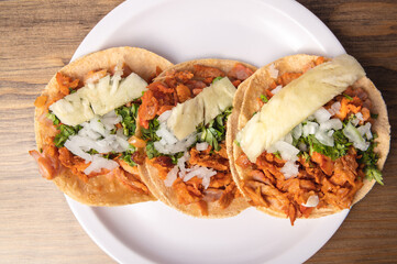 Pastor tacos with corn tortillas. Mexican food. Mexican food concept on wooden table. Traditional mexican food.