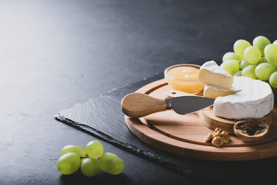 Sliced Brie Cheese Served With Knife