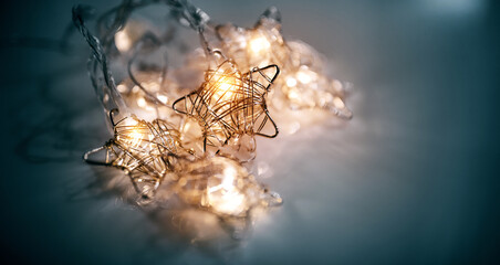 Christmas luminous garland in the shape of stars