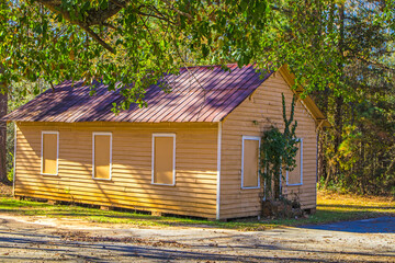 A boarded up yellow building