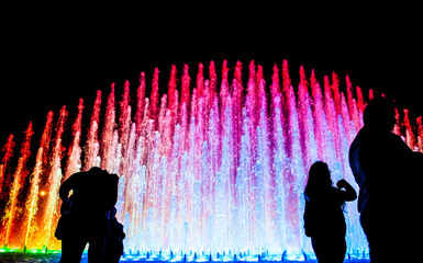 Tourists at Rainbow Fountain at the Magic Water Circuit (world's largest fountain complex), Park of...