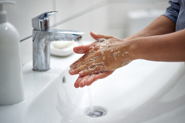 Washing hands by rubbing palms with soap. Prevention of viral and bacterial infections. Fighting the coronavirus epidemic.