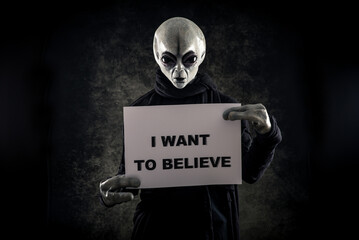 Alien creature has a message for humans. Grey kind humanoid from an other planet portrait series. © oneinchpunch
