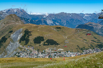 View from ski lift on Les deux Alpes and Alpine mountains peaks in summer, Isere, France