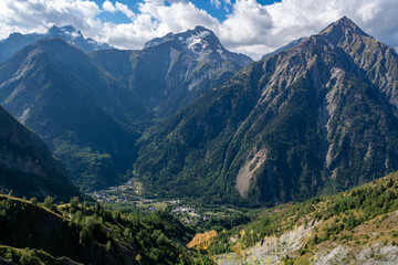Fototapeta premium Hiking near ski station Les deux Alpes and view on Alpine mountains peaks in summer, Isere, France
