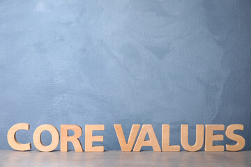 Phrase CORE VALUES made of wooden letters on light table