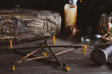 Branch Pentagram - witchcraft tools of natural wood. Spells still life with elements of pagan magic. occultism and mysticism.