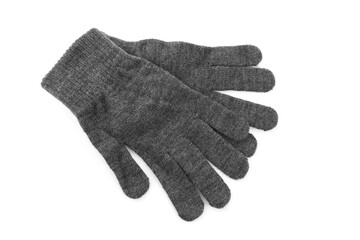 Grey woolen gloves on white background, top view. Winter clothes