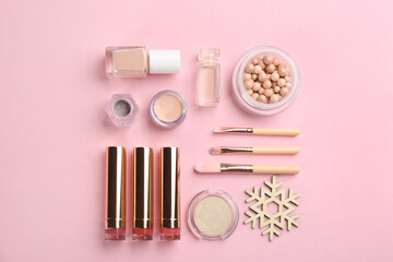Obraz na płótnie Canvas Flat lay composition with decorative cosmetic products on pink background. Winter care