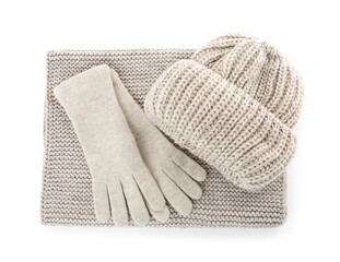 Woolen gloves, hat and scarf on white background, top view. Winter clothes