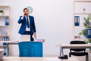 Young male employee working in the office