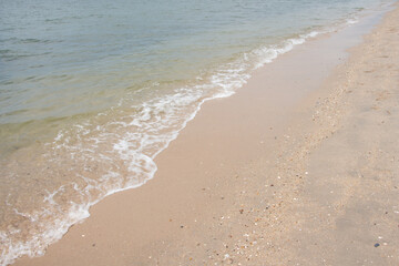 Wave of the sea on the sand beach. background.