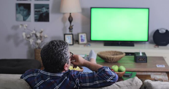man watching match on tv