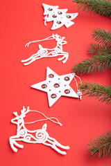 Christmas or New Year composition. Decorations on a red background. Side view.