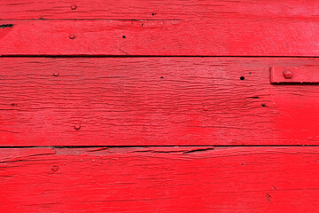 old wooden fence with red paint, wood texture