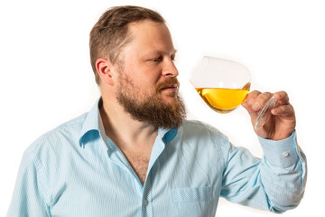 Fototapeta premium Solid bearded man in shirt tasting whisky studio portrait