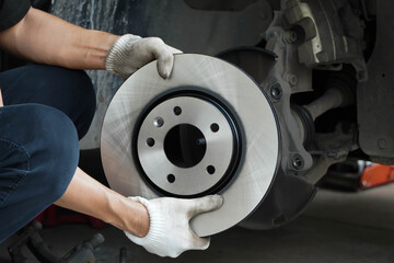 Brand new brake discs for garage cars. Auto mechanic

