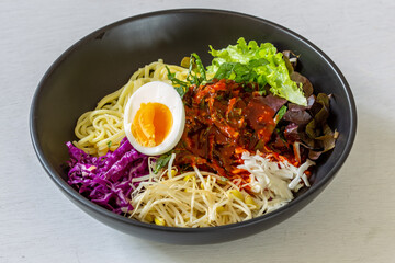 Korean food, JJolmyeon which is mixed with cold chewy noodles with vegetables and spicy sauce