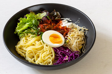 Korean food, JJolmyeon which is mixed with cold chewy noodles with vegetables and spicy sauce