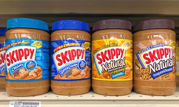 Alameda, CA - Oct 2, 2020: Grocery store shelf with jars of Skippy brand Peanut butters. Creamy, Super Chunk,  Creamy with Honey and Super Chunk natural.
