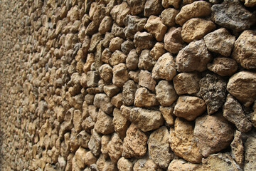 Stone walls are composed of brown stone. Selected focus