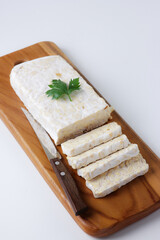 Tempe is an Indonesian traditional food, made from fermented soybeans.