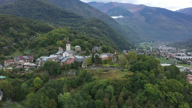 Aerial shot of the pretty old town (Conflans) overlooking Albertville, beautiful view of an old city surrounded by mountains,  View of the Conflans, the medieval city located in upper savoy, France
