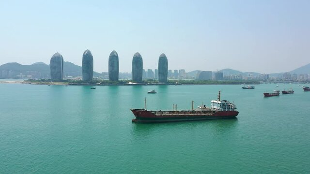 sunny day hainan island sanya bay ship parking famous hotel aerial panorama 4k china